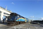 Tri-Rail F40PH-3C # 808 pushes Train # 666 away from the MIC toward its next stop at Hialeah Market Station